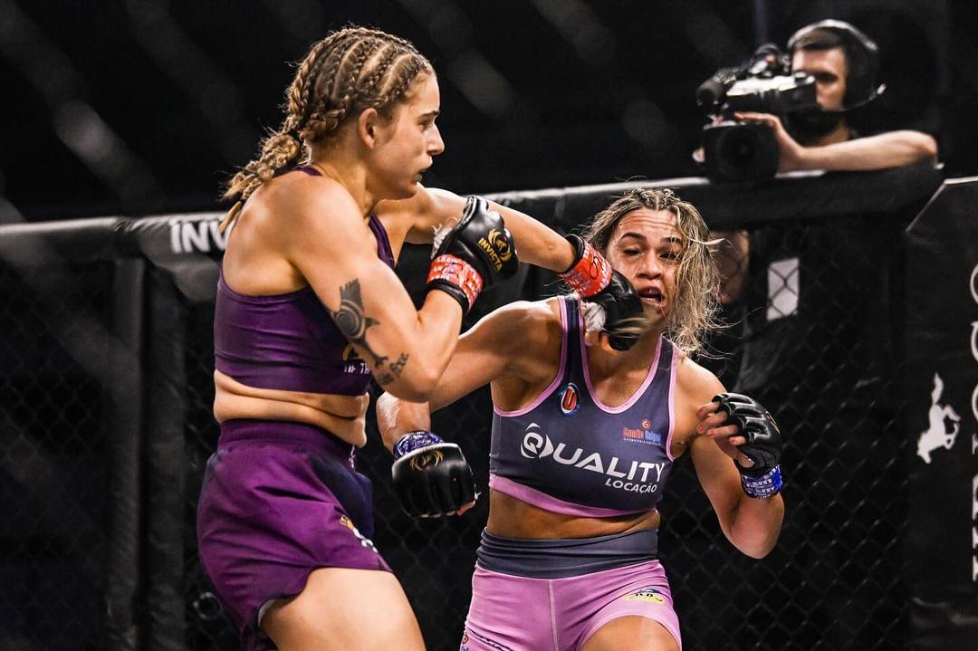 Kate Bacik landing a strike on her opponent during an Invicta FC bout